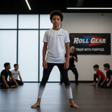 Roll Gear White Fade Training Spats for kids, black with white fade, moisture-wicking performance fabric.