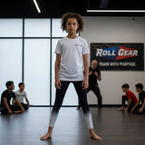 Roll Gear white fade training spats for kids, white fading to black, moisture-wicking performance fabric, 4-way stretch.