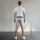 Roll Gear adult/unisex white short-sleeve performance rash guard with grey stitching and logo on back.