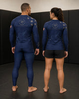 Roll Gear Women's Air Force Blue & Silver military rash guard with graphic print and US flag detail on sleeve.