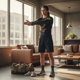 Roll Gear Women’s Marines Gold military rash guard, black with faded gold sleeves and USMC emblem. Compression fit, long sleeve, polyester-elastane blend.