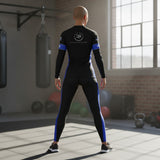 Roll Gear Women's black long sleeve rash guard with blue side panels and Thin Blue Line accents. Features "POLICE" lettering and badge emblem.