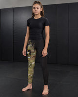 Roll Gear Youth Army Compression Spats in black camo and tactical black with Army graphics. Performance leggings for sports.