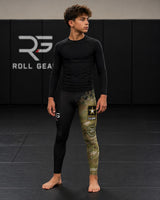 Roll Gear Youth Army Compression Spats in black and military camo with U.S. Army graphics. Polyester/spandex blend.