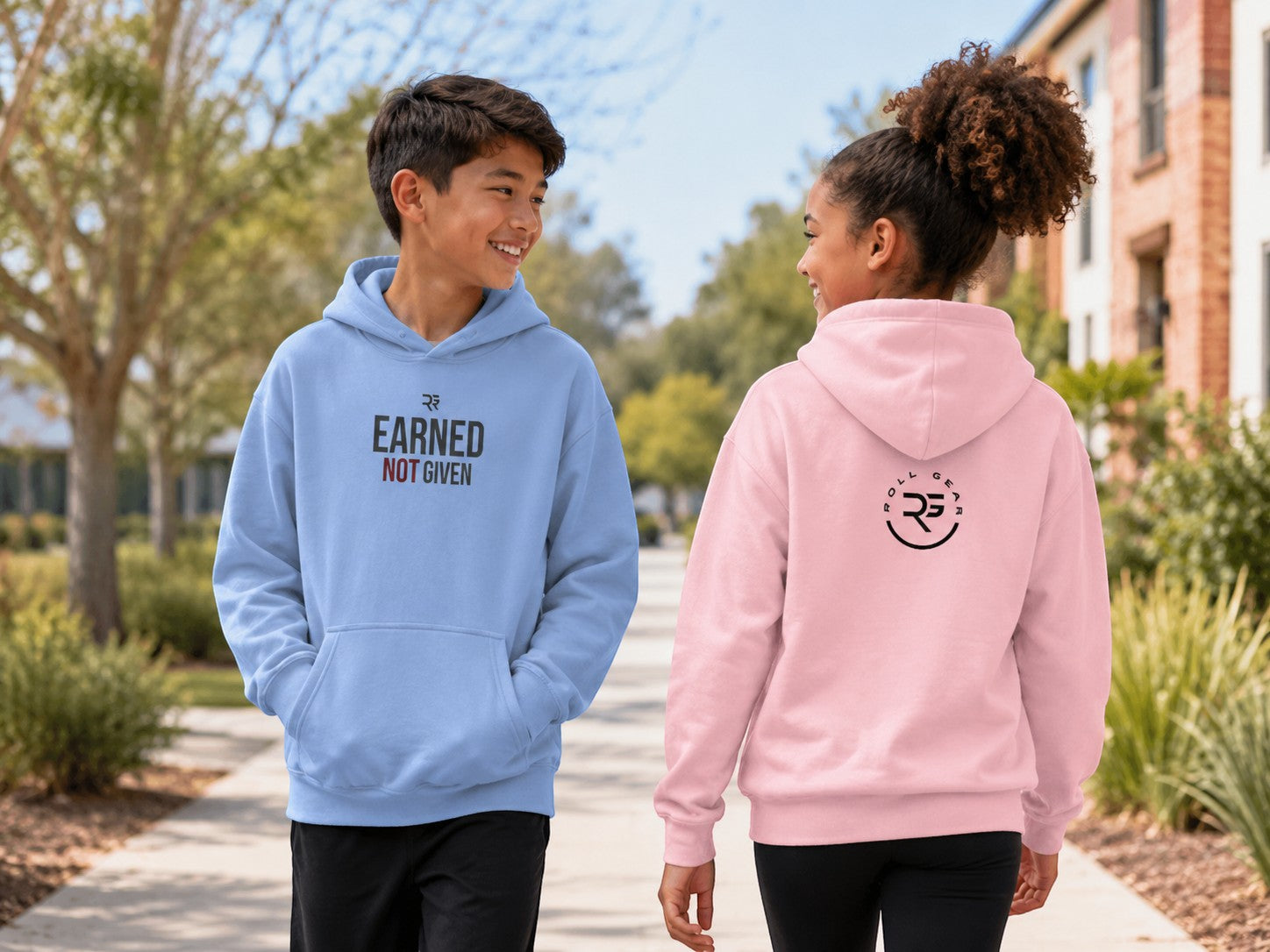 Roll Gear youth heavyweight hoodie in light blue with "Earned Not Given" graphic on front. Kids BJJ hoodie.