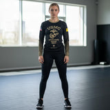 Roll Gear Youth Marines "Gold" long sleeve rash guard in black with faded gold sleeves and USMC emblem. Compression fit for athletic training.