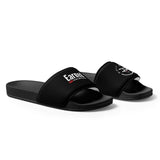 Roll Gear black women's slides with cushioned footbed and slip-on design, featuring 'Earned' text and logo.