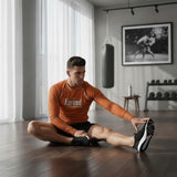 Roll Gear long sleeve rash guard in burnt orange, designed for BJJ and grappling. Features 4-way stretch and moisture-wicking fabric.