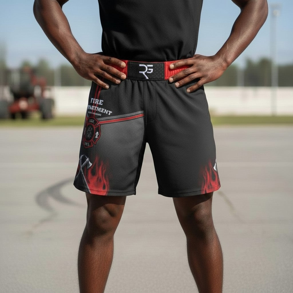 Roll Gear LLC black grappling shorts with red waistband, featuring fire department graphics and flames. Designed for training.