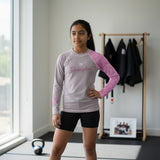 Roll Gear grey and pink youth performance rash guard with long sleeves and a crew neck. Features 'Discipline' graphic.