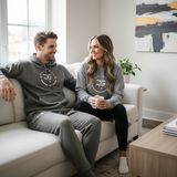 Roll Gear Fleece Joggers, asphalt, couple relaxing on a couch.